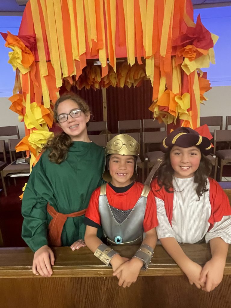 three children in costume